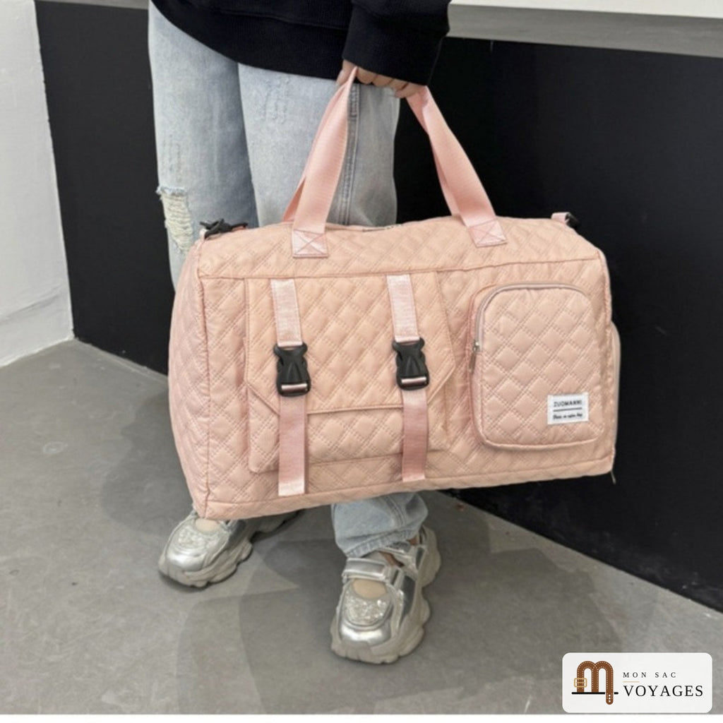 Sac de voyage Riviera rose porté à la main