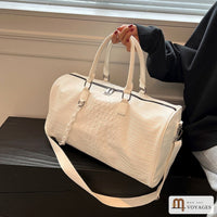 Sac de voyage week-end Croisette blanc tenu par ses anses