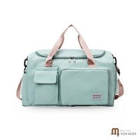 Sac de voyage week-end Capri vert d'eau avec anses roses, compartiment chaussures et poches avant