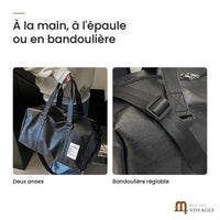 Sac de voyage noir Milano porté par ses deux anses et détail de sa bandoulière réglable