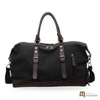 Sac de voyage en toile Bivouac noir vu de face, finitions marron