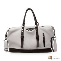 Sac de voyage en toile Bivouac blanc cassé vu de face, finitions marron