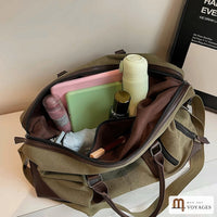 Intérieur du sac de voyage Bivouac : doublure marron et poche zippée