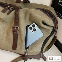 Poche zippée en façade du sac de voyage Bivouac avec un téléphone