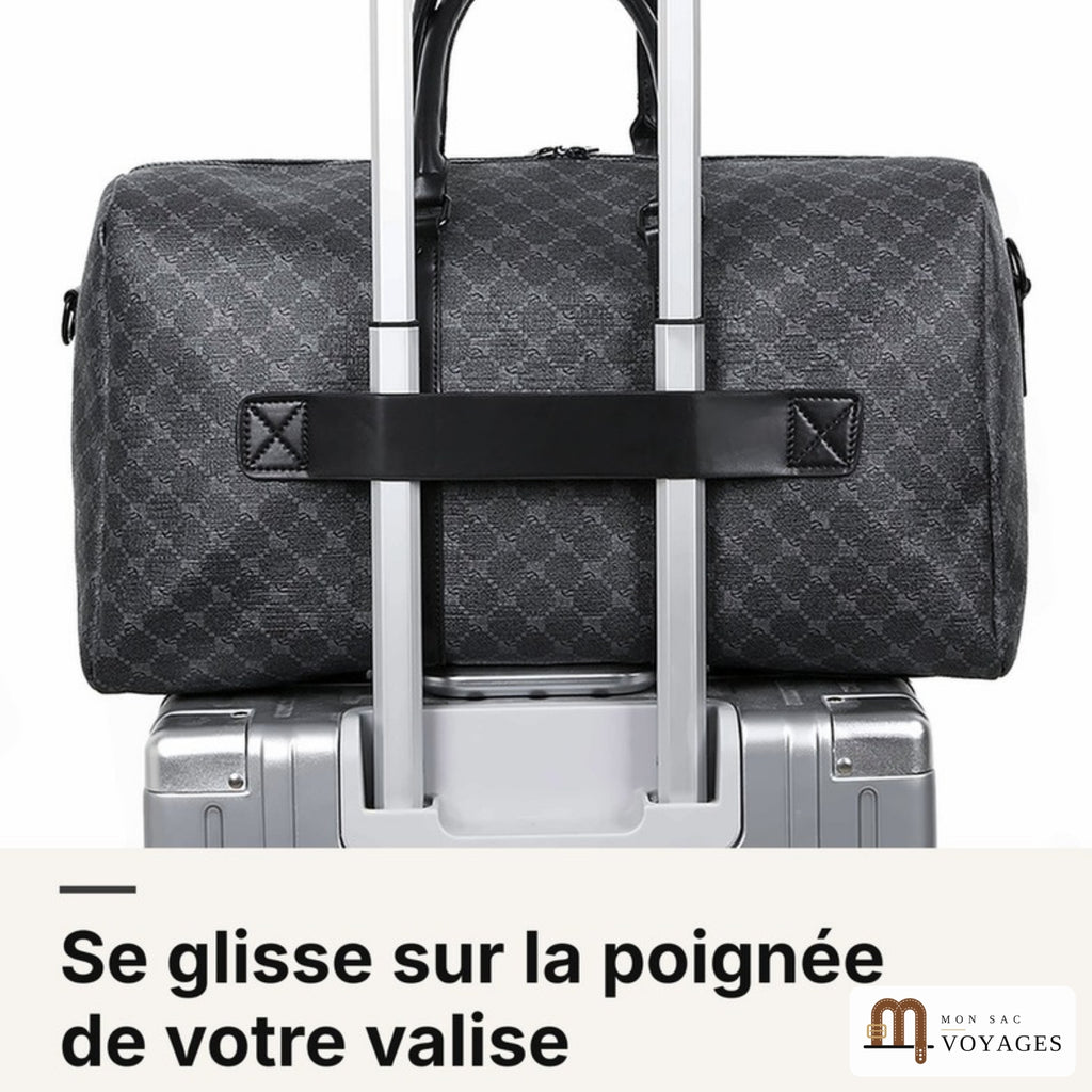 Sac de voyage Dandy fixé sur la poignée télescopique d'une valise