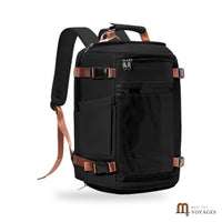 Sac à dos de voyage Odyssée noir avec sangles marron vu de face sur fond blanc