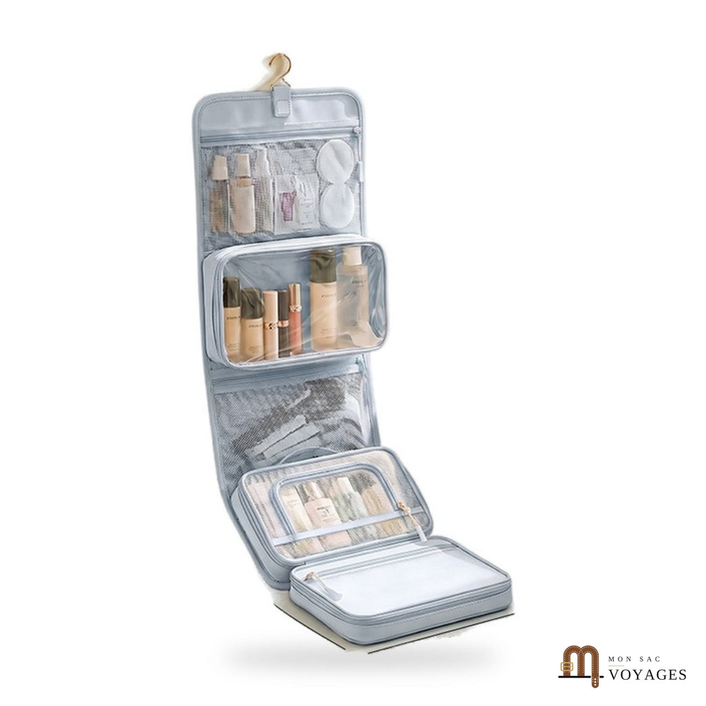 Trousse de toilette suspendue Lagune bleu glacier dépliée avec son crochet sur fond blanc