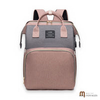 Sac à langer sac à dos Nid rose et gris avec lit bébé pliable, sur fond blanc