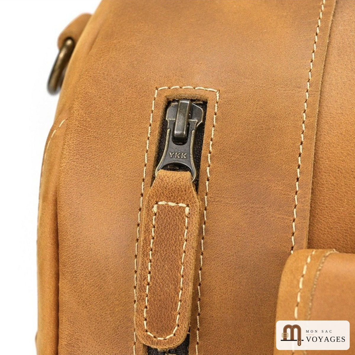 Détail zip YKK et patte en cuir du sac de voyage cuir véritable